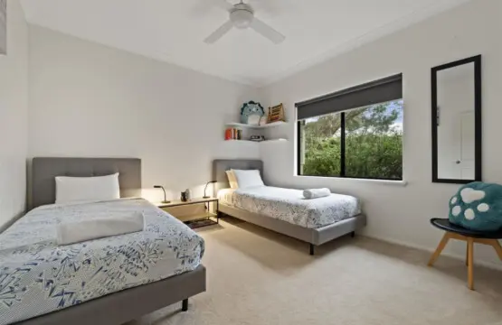 Bedroom 3 - 2 Single beds, Ceiling fan, and a Garden view