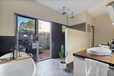 Ensuite bathroom, Egg-shaped Bathtub, Vanity, Shower, Separate toilet and an Outdoor seating area