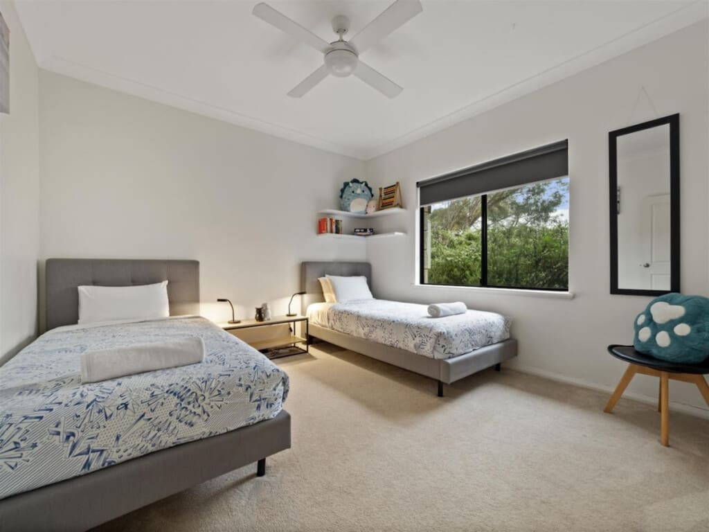 Bedroom 3 - 2 Single beds, Ceiling fan, and a Garden view