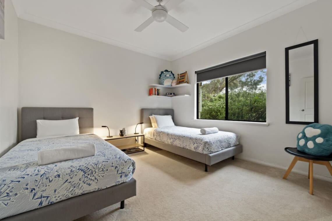 Bedroom 3 - 2 Single beds, Ceiling fan, and a Garden view