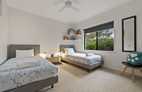 Bedroom 3 - 2 Single beds, Ceiling fan, and a Garden view