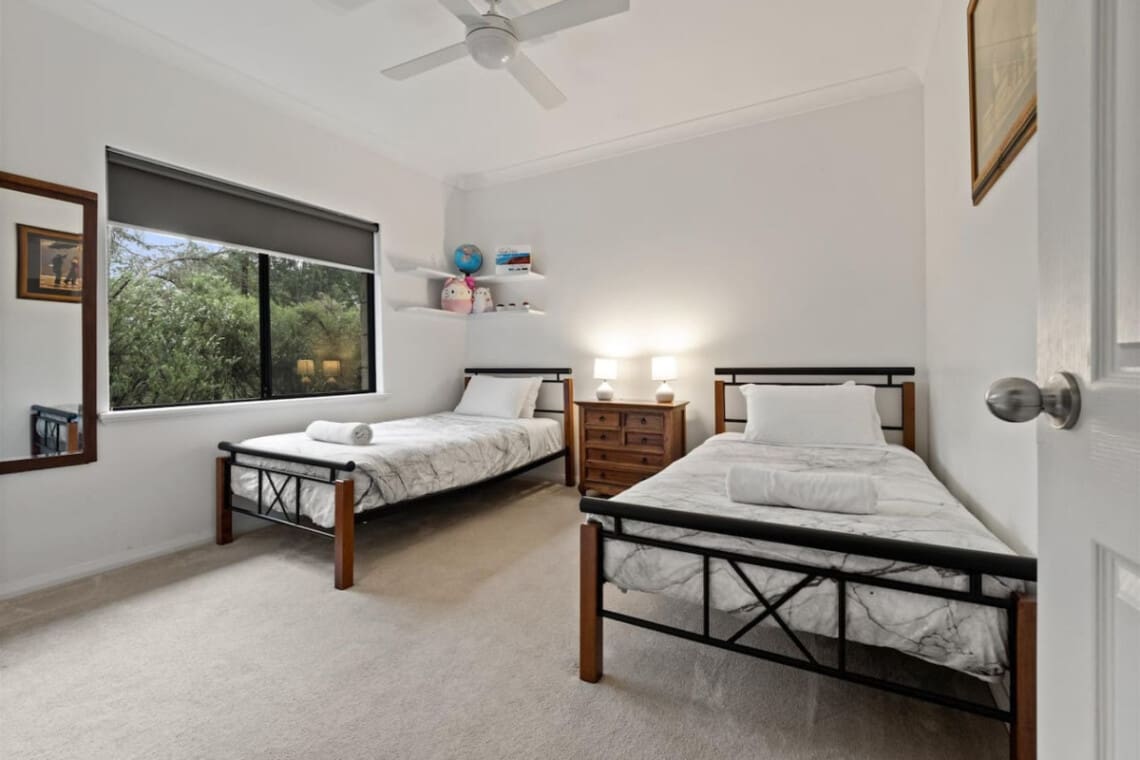 Bedroom 4 - 2 Single beds, Ceiling fan, and a Garden view