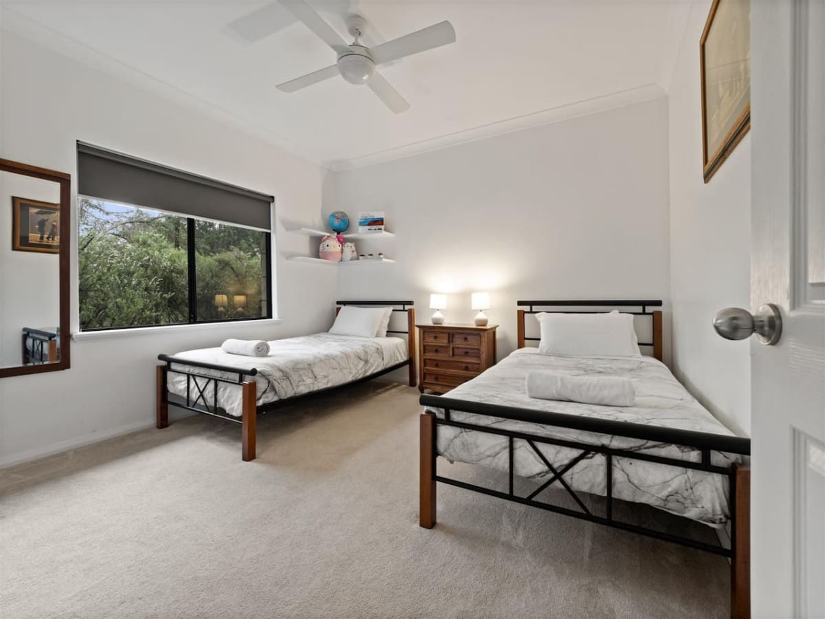 Bedroom 4 - 2 Single beds, Ceiling fan, and a Garden view