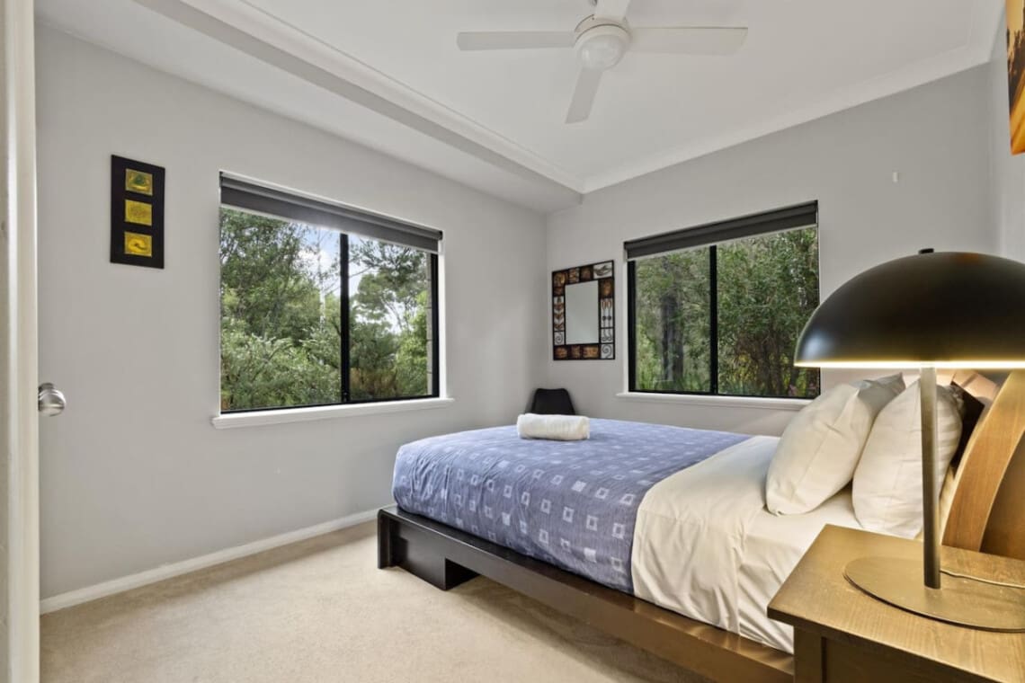 Bedroom 2 - 1 Queen bed, Ceiling fan, and a Garden view