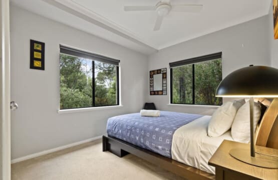 Bedroom 2 - 1 Queen bed, Ceiling fan, and a Garden view