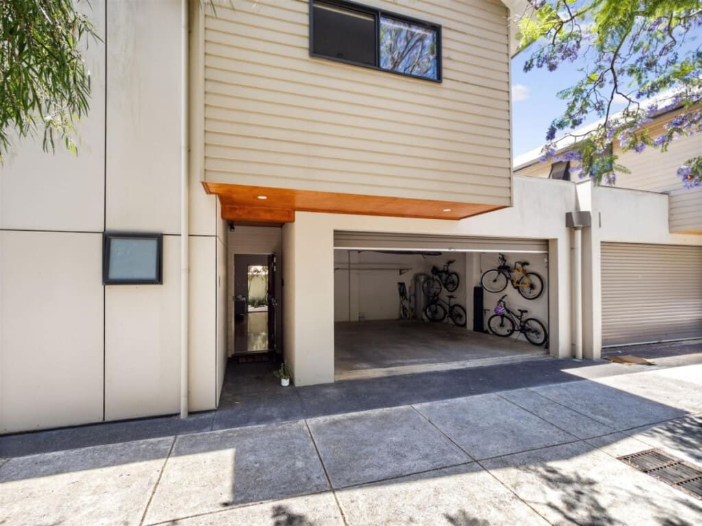 Remote-controlled garage for 2 cars and a BBQ grill.