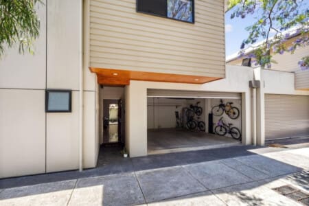 Remote-controlled garage for 2 cars and a BBQ grill.
