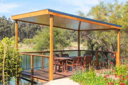 Deck with outdoor seating and lake view