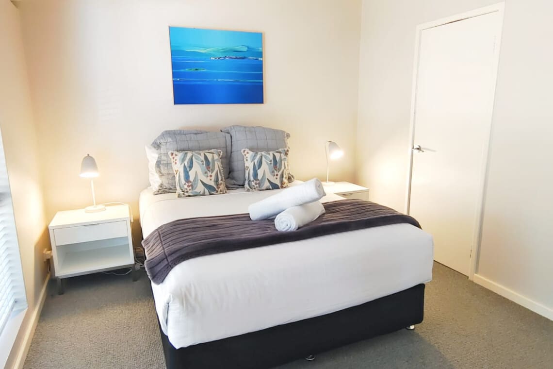 Bedroom 1 - 1 Queen Bed, Ensuite Bathroom, Walk-in Robe, and Ceiling Fan