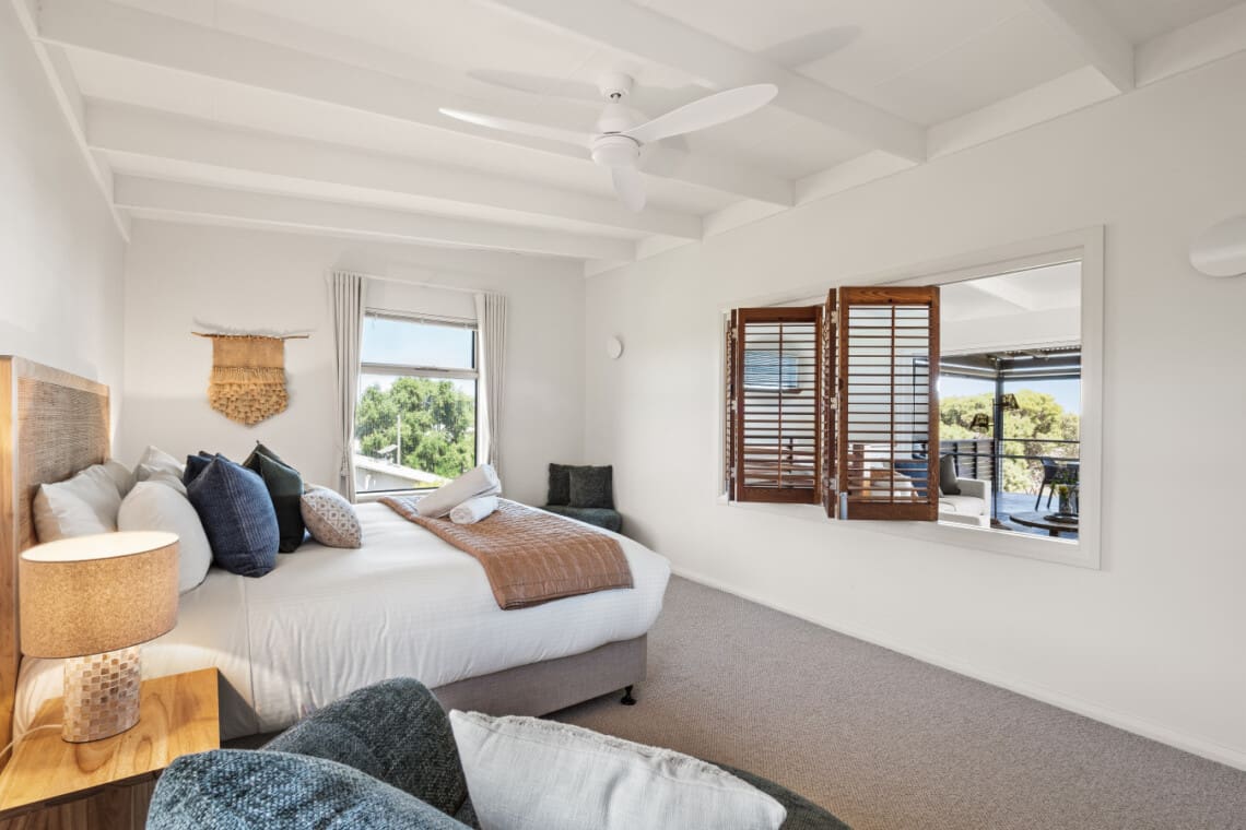 Bedroom 1 – 1 King Bed – Upstairs, with ceiling fan, ensuite bathroom, and walk-in wardrobe