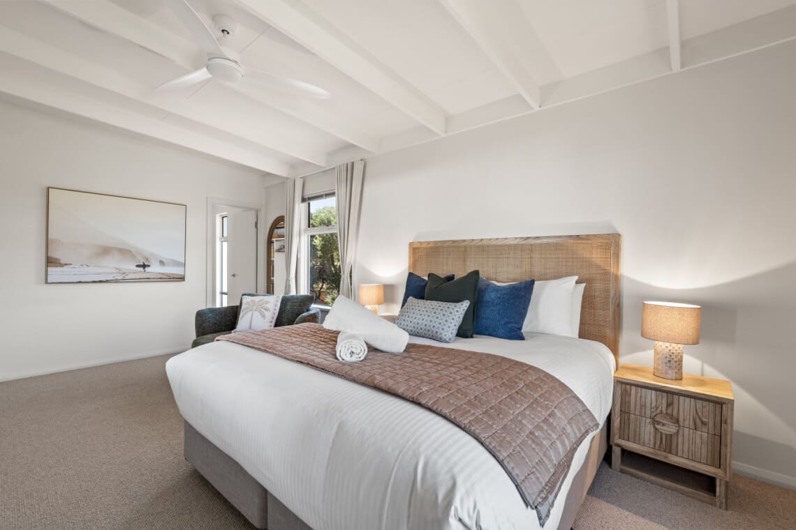 Bedroom 1 – 1 King Bed – Upstairs, with ceiling fan, ensuite bathroom, and walk-in wardrobe